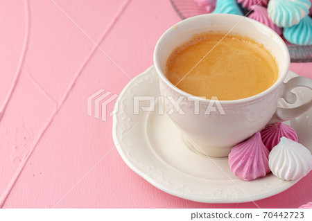 Cup of coffee with colorful cookies close up 70442723