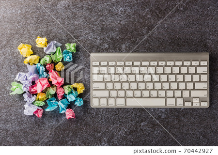 crumpled paper stick note ball with computer keyboard crumpled paper stick note ball with computer keyboard 70442927
