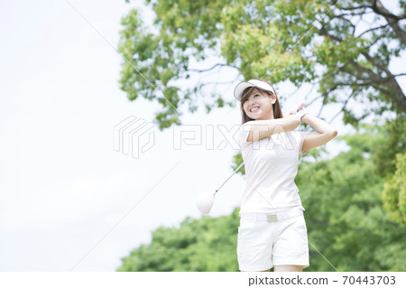 Women playing golf Women playing golf 70443703