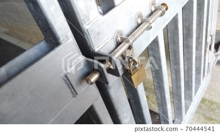 Padlocked iron gate 70444541