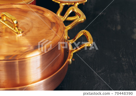 Clean copper cookware in kitchen close up 70448390