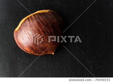 Fresh one chestnut isolated on black background 70449355