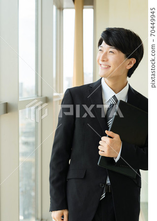 A young man in a suit A young man in a suit 70449945