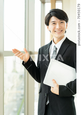 A young man in a suit A young man in a suit 70450179