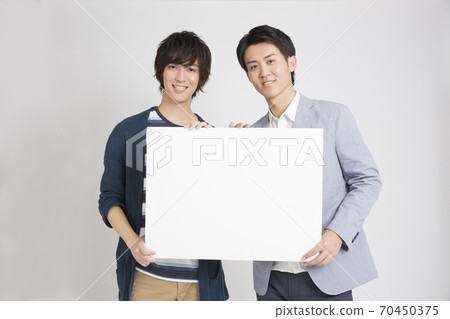 A man with a message board A man with a message board 70450375