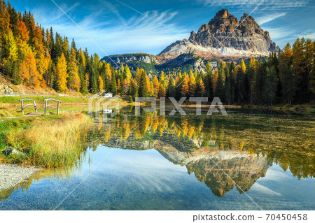 Beautiful alpine lake with high peaks in background, Dolomites, Italy 70450458