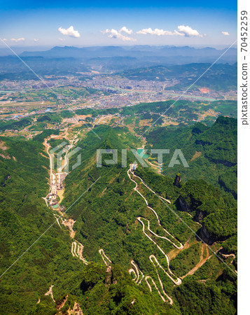 Aerial view of tianmen city with curve road to the mountain, China 70452259