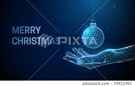 Abstract low poly giving hand with Christmas ball. Abstract low poly giving hand with Christmas ball. 70452465