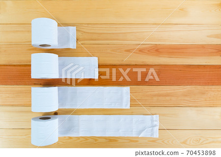 White tissues paper or toilet paper on wooden table. White tissues paper or toilet paper on wooden table. 70453898