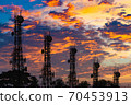 Silhouette of the Antenna of cellular cell phone and communication system tower arranged as a bar chart on cloud and blue sky background, Telecommunication technology concept. 70453913