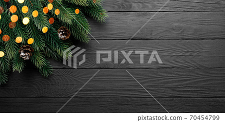 Fir Tree on Vintage Black table with free blank copy space for greeting text 70454799