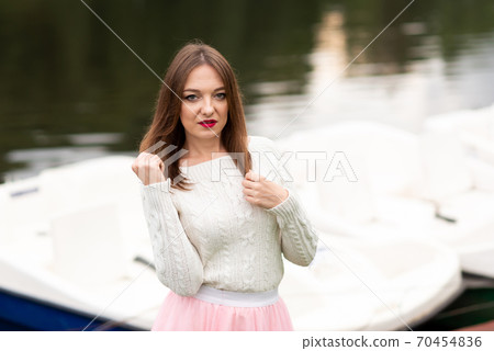 The girl on the pier with catamarans 70454836