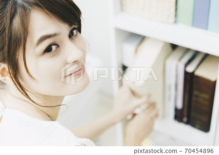 Bookshelf and women Bookshelf and women 70454896