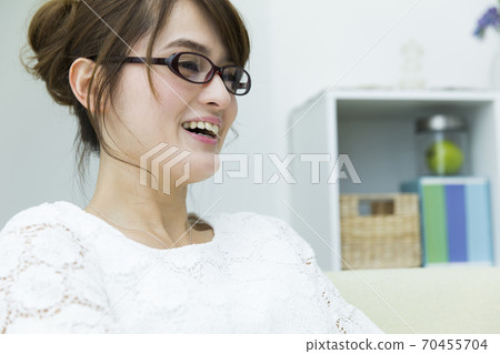 A woman watching TV A woman watching TV 70455704