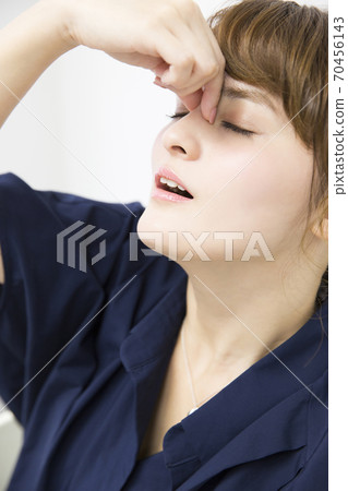A woman with fatigue 70456143