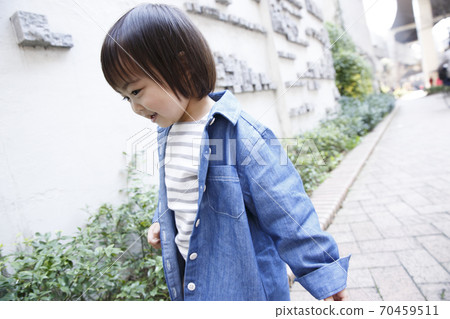 Toddler taking a walk 70459511