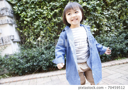 Toddler taking a walk 70459512