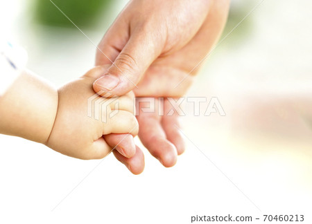 Mother and baby hold hands Parent-child contact Mother and baby hold hands Parent-child contact 70460213