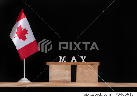 Wooden calendar of May with Canadian flag on black background. Holidays of Canada in May Wooden calendar of May with Canadian flag on black background. Holidays of Canada in May 70460613