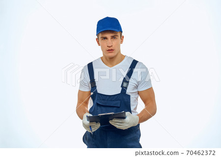 Working man in uniform documents delivery service courier 70462372