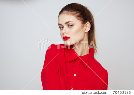 portrait of a woman with red lips in a shirt on a light background cropped view model makeup hairstyle portrait of a woman with red lips in a shirt on a light background cropped view model makeup hairstyle 70463186