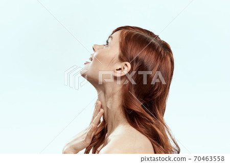 Pretty woman holding hair smile cosmetics lifestyle naked shoulders hairstyle care charm light background Pretty woman holding hair smile cosmetics lifestyle naked shoulders hairstyle care charm light background 70463558