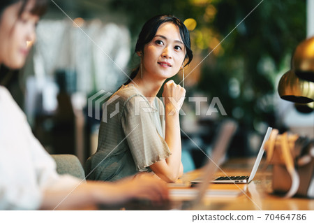 Woman working in coworking space Woman working in coworking space 70464786