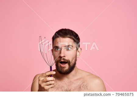 man with head massager relax body care pink background man with head massager relax body care pink background 70465075