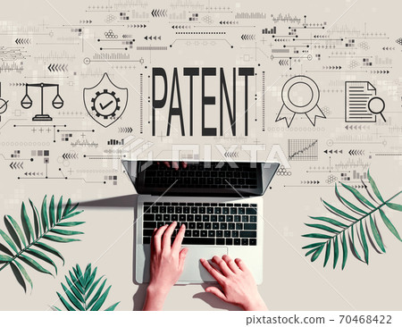 Patent concept with person using a laptop Patent concept with person using a laptop 70468422