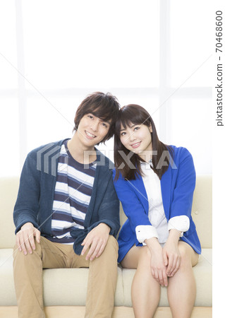 A couple snuggling up to each other A couple snuggling up to each other 70468600