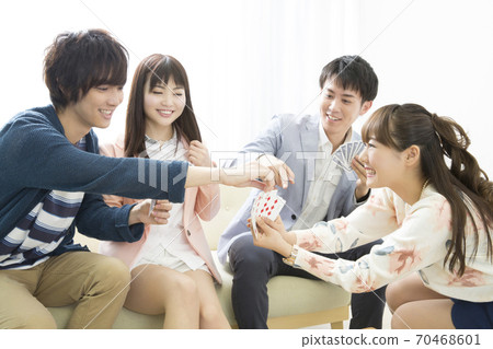 Men and women playing cards Men and women playing cards 70468601