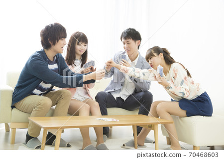 Men and women playing cards Men and women playing cards 70468603