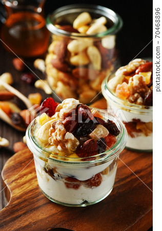 Yogurt with nuts and fruits 70468896