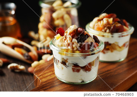 Yogurt with nuts and fruits 70468903