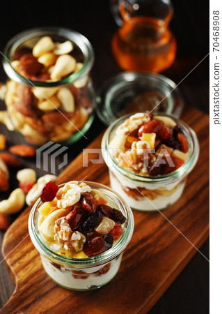 Yogurt with nuts and fruits 70468908