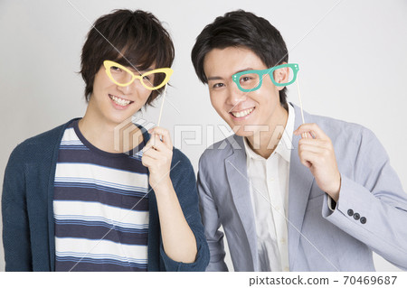 Men playing with props Men playing with props 70469687