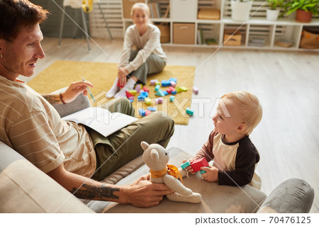 Father playing with child Father playing with child 70476125