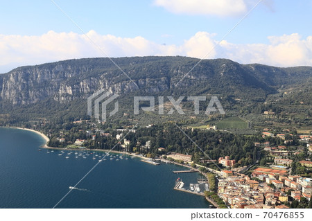 Garda View. An aerial view from Rocca across the town of Garda. Garda is a town on the edge of Lake Garda in North East Italy and Rocca is a large hill overlooking the town. Garda View. An aerial view from Rocca across the town of Garda. Garda is a town on the edge of Lake Garda in North East Italy and Rocca is a large hill overlooking the town. 70476855