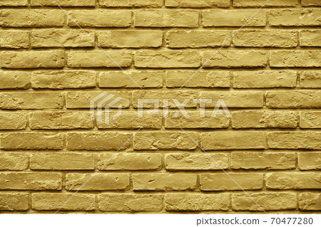 Golden paint brick wall 70477280