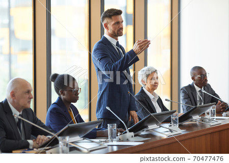 Man performing at conference Man performing at conference 70477476