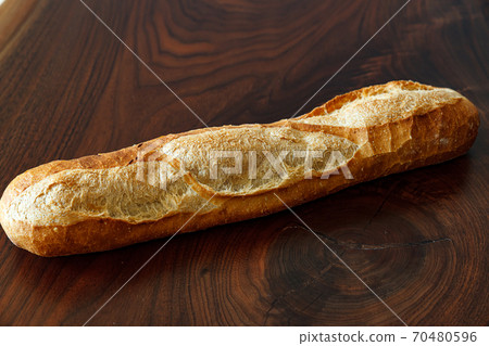 French bread on a wooden board 70480596