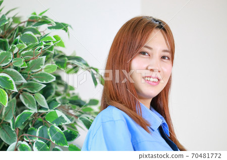 Portrait of female staff in uniform 70481772