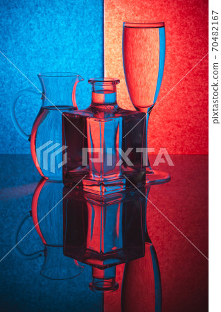Still life with glass objects on a colored background Still life with glass objects on a colored background 70482167