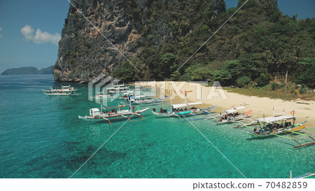Philippines ocean bay aerial: passenger ship at coast. Local boat cruise tour for tourist, traveler 70482859