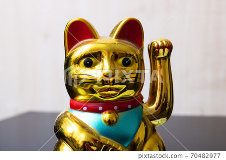 Maneki neko cat closeup, japan lucky charm Maneki neko cat closeup, japan lucky charm 70482977