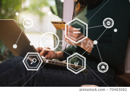hipster hand using smart phone for mobile payments online business,headphone,sitting. Online Shopping payments concept. hipster hand using smart phone for mobile payments online business,headphone,sitting. Online Shopping payments concept. 70483082