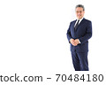 A businessman who welcomes you with a gentle smile 70484180