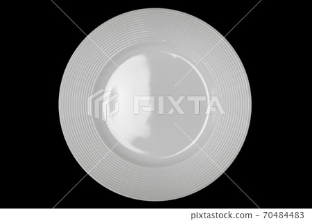 Top view white dish on black background. 70484483