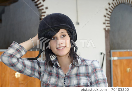 portrait of a beautiful young woman rider 70485200