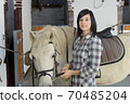 Beautiful young girl and white horse 70485204